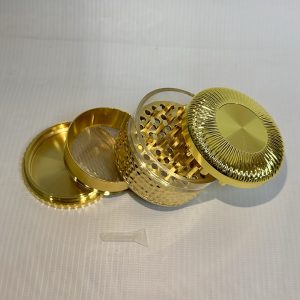 Moledor metálico dorado